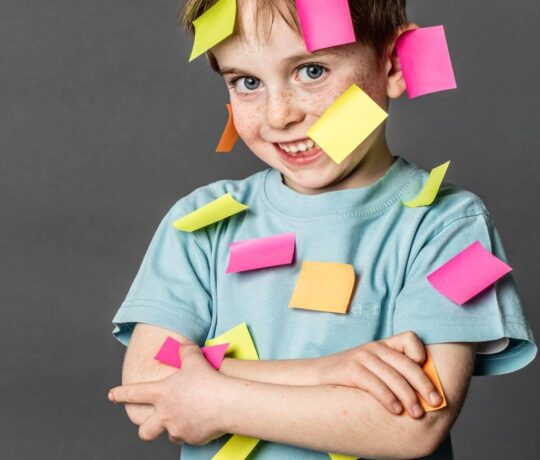 kid with post-its all over him
