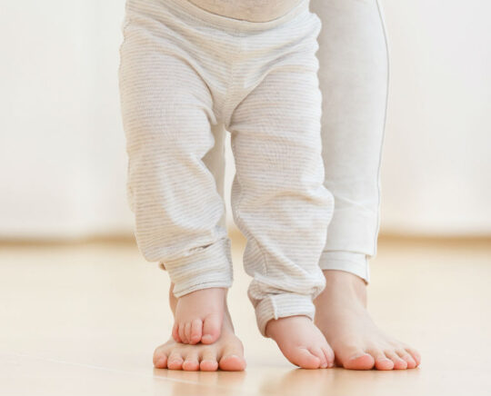 baby learning how to walk fro the first time