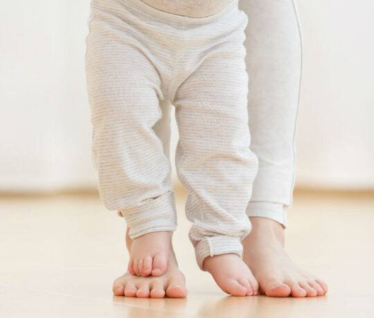 baby learning how to walk fro the first time