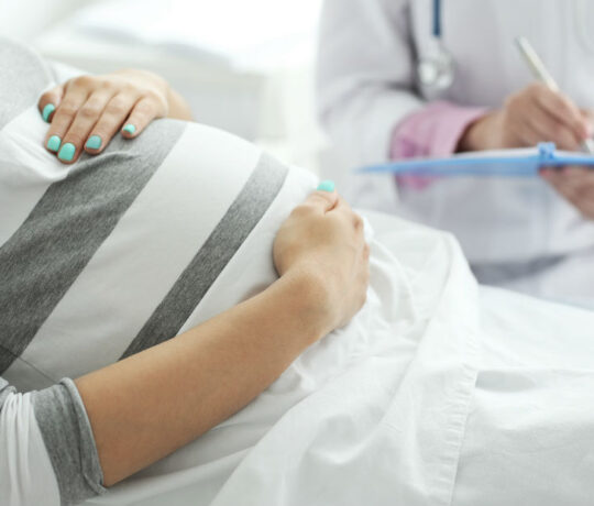 pregnant woman meeting doctor