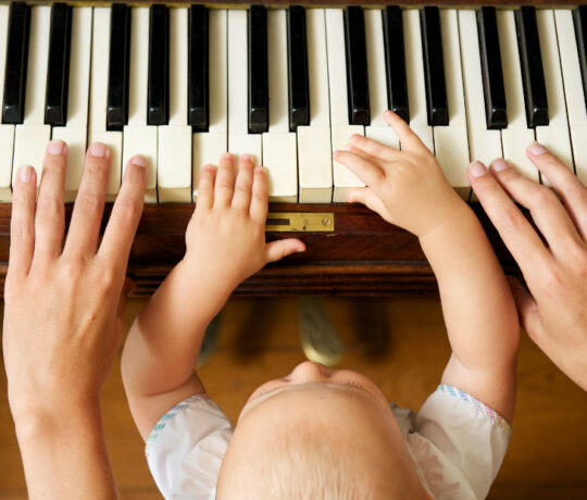 baby learns how to play piano