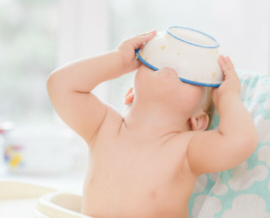 baby devouring food