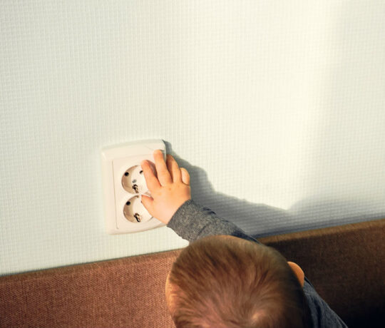 toddler touching socket
