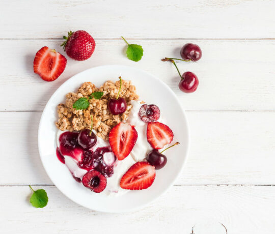 yogurt with granola and strawberries
