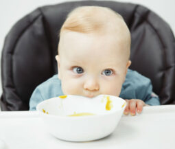 baby eating cream