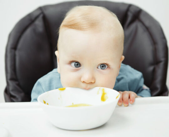 baby eating cream