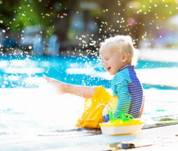 little kid having fun at the pool