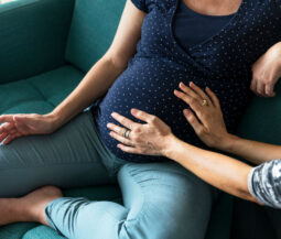 pregnant with belly touched