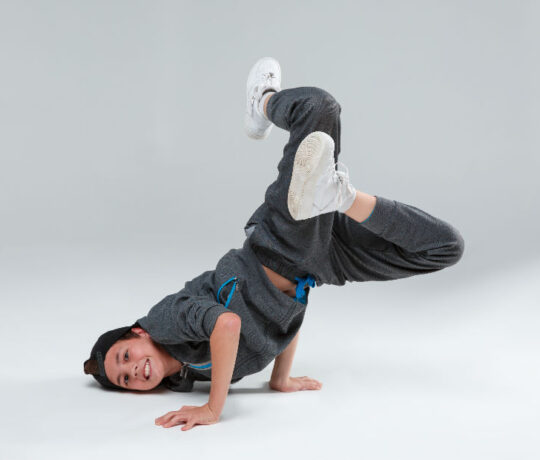 kid doing a breakdancing pose