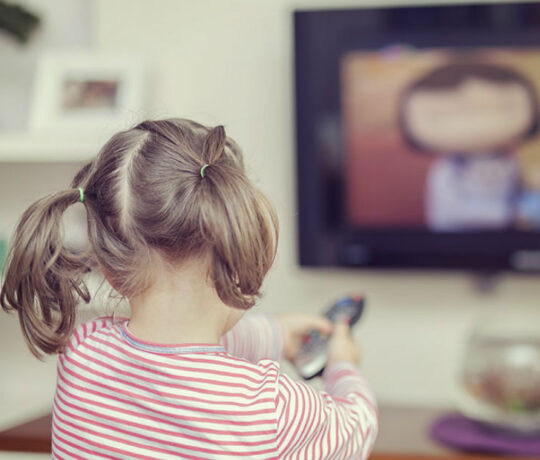 little girl watching tv