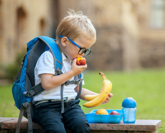 kid eating fruits at school