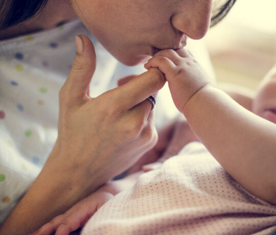 kissing newborn