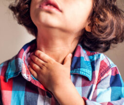 little boy with sore throat