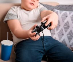 chubby kid playing video games