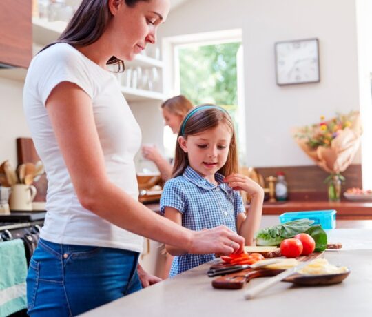mom prepares healthy food for kid