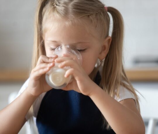 little girl drinking milk