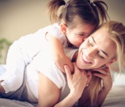 happy toddler with mom