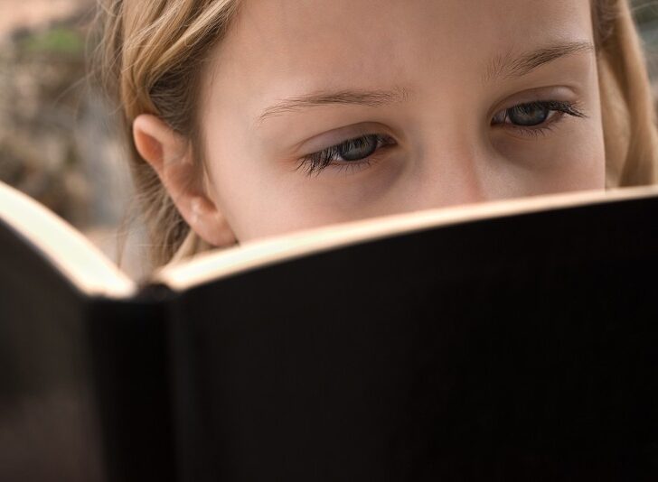kid reading book