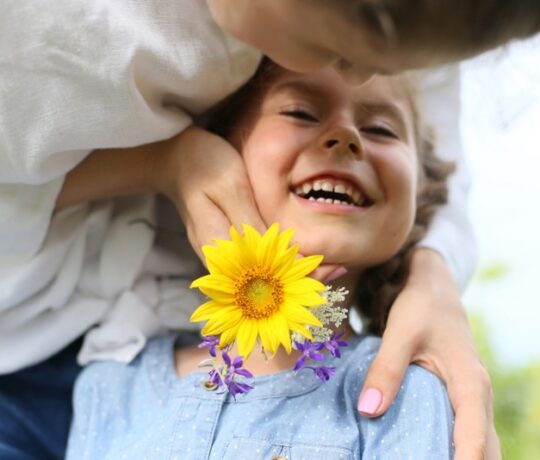 little girl happy with mom