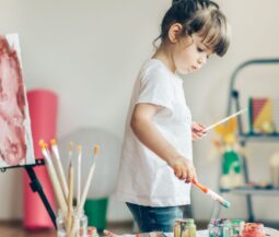 girl painting with brushes