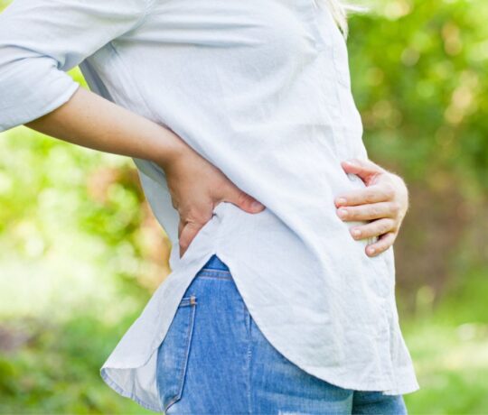 pregnant woman touching belly