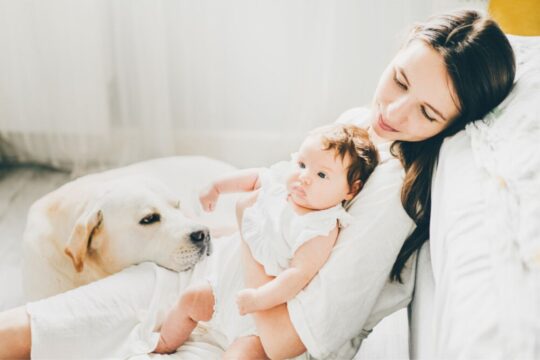 woman with baby and dog