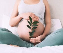 pregnant woman touching her belly