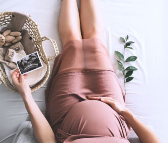 pregnant woman watching her ultrasound