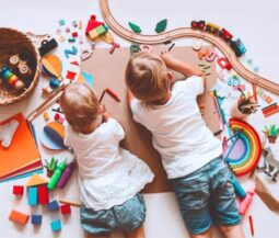 two kids playing on the floor
