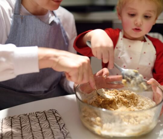 baby boy cooking with mum
