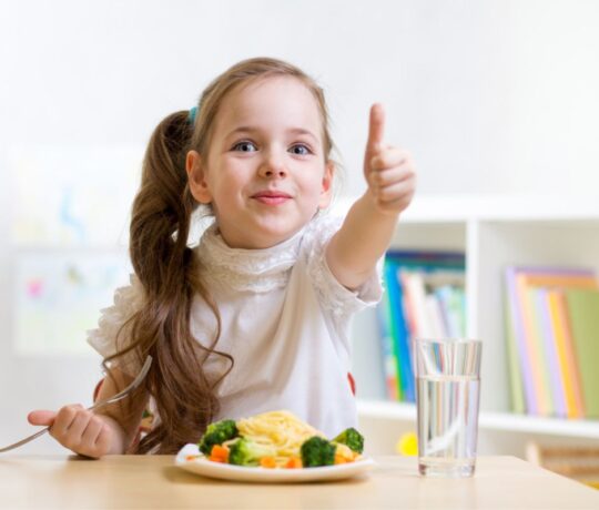 girl eating happy healthy meal