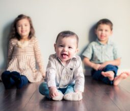 three siblings on the floor