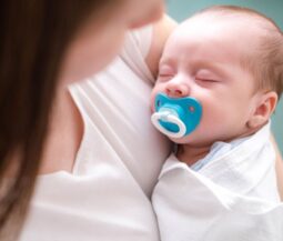 newborn with dummy