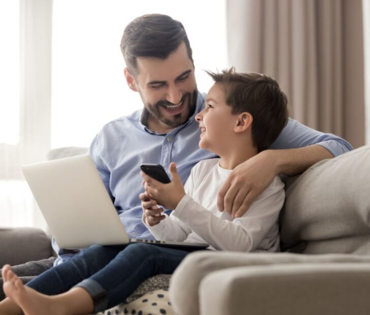father and son playing online games