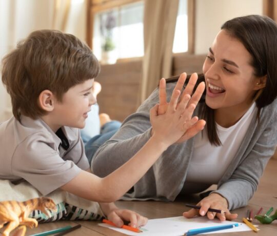 child with his mother high five