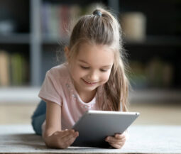 girl playing with her tablet