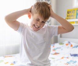 kid scratching his head