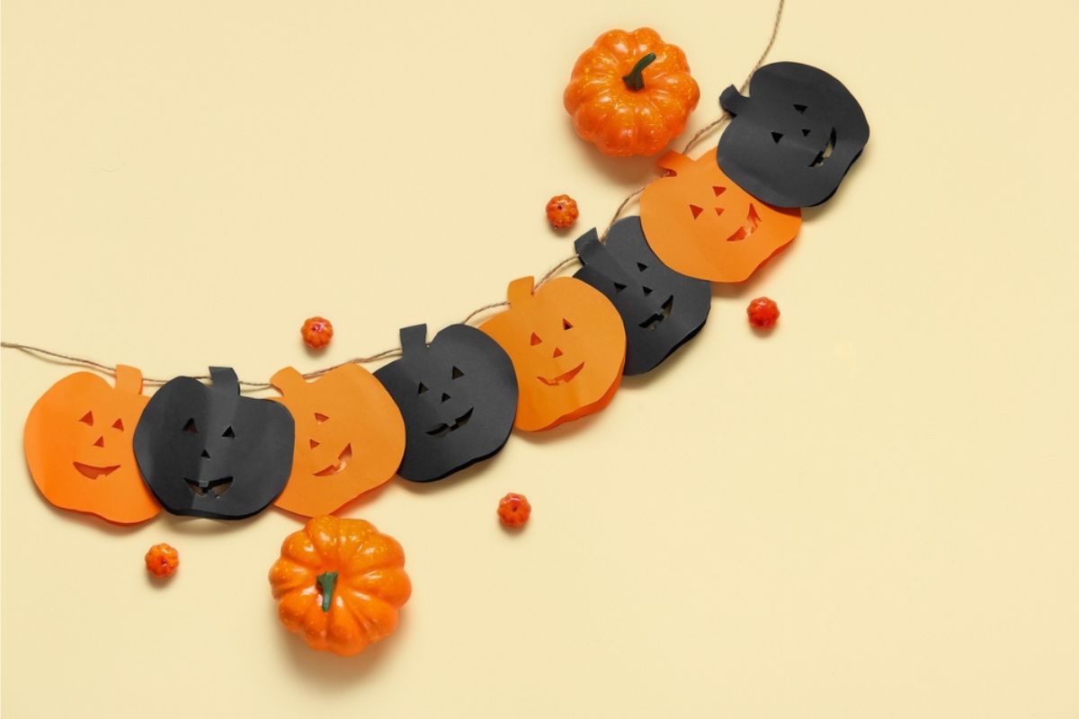 Garland made of paper pumpkins for halloween celebration