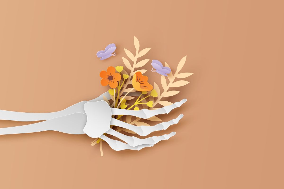 ghost bone hand holding flower