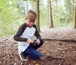 kid playing with woods