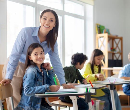 Happy children with teacher