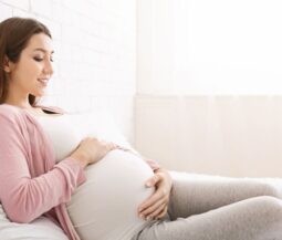 pregnant woman caress her belly