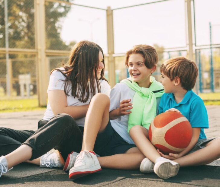 Kids playing with their mom