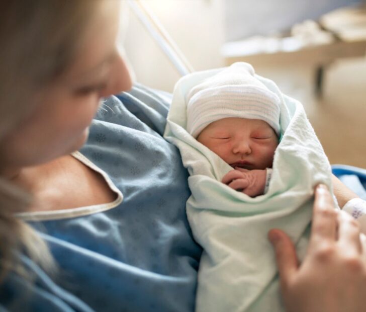 Mom with newborn hug