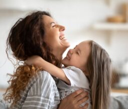 Kid hugs his mother