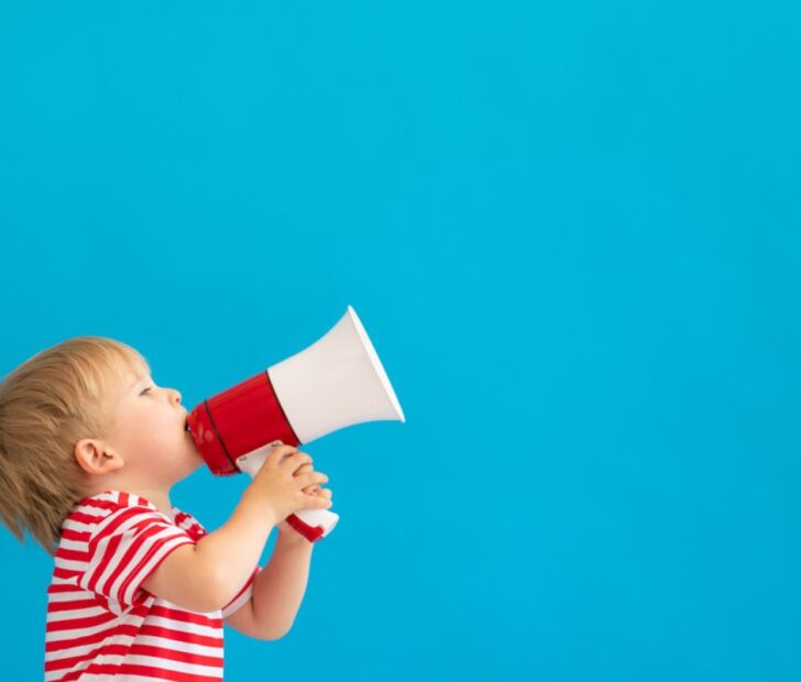 toddler holding megaphone