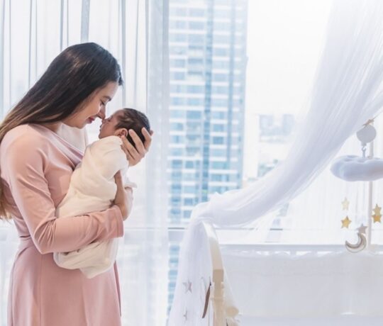 Mom hugs newborn