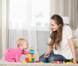 mom plays with baby